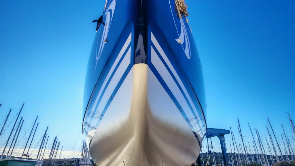 Polished sailboat hull in dry dock — professional boat detailing service Croatia
